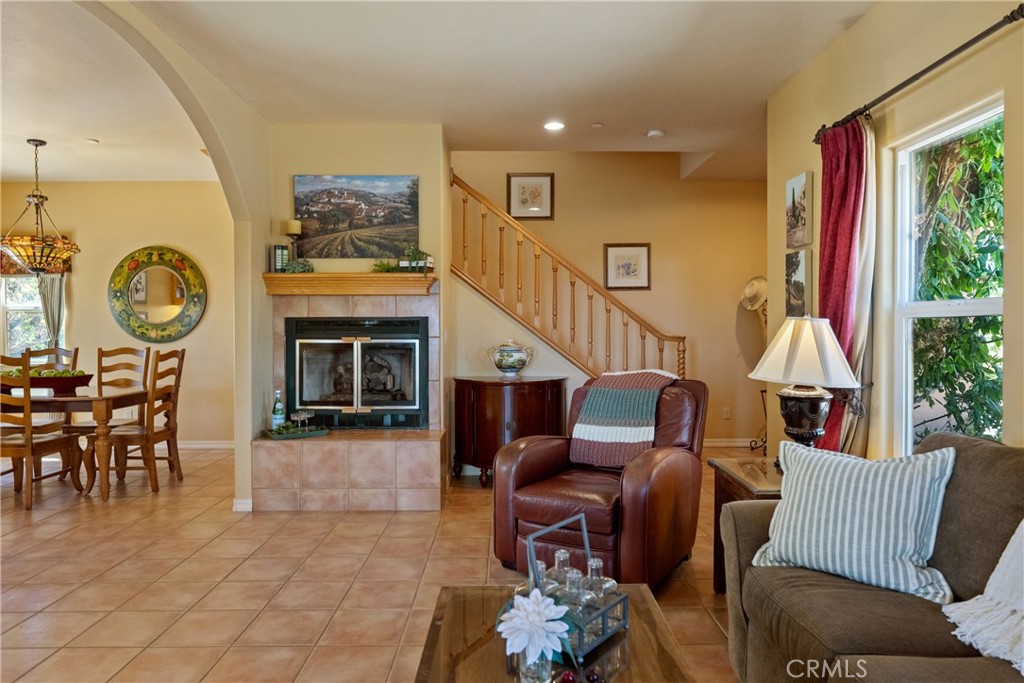 725 Spring Creek Way Templeton, CA 93465 - Photo 47 of 70 a living room with furniture a fireplace and a large window