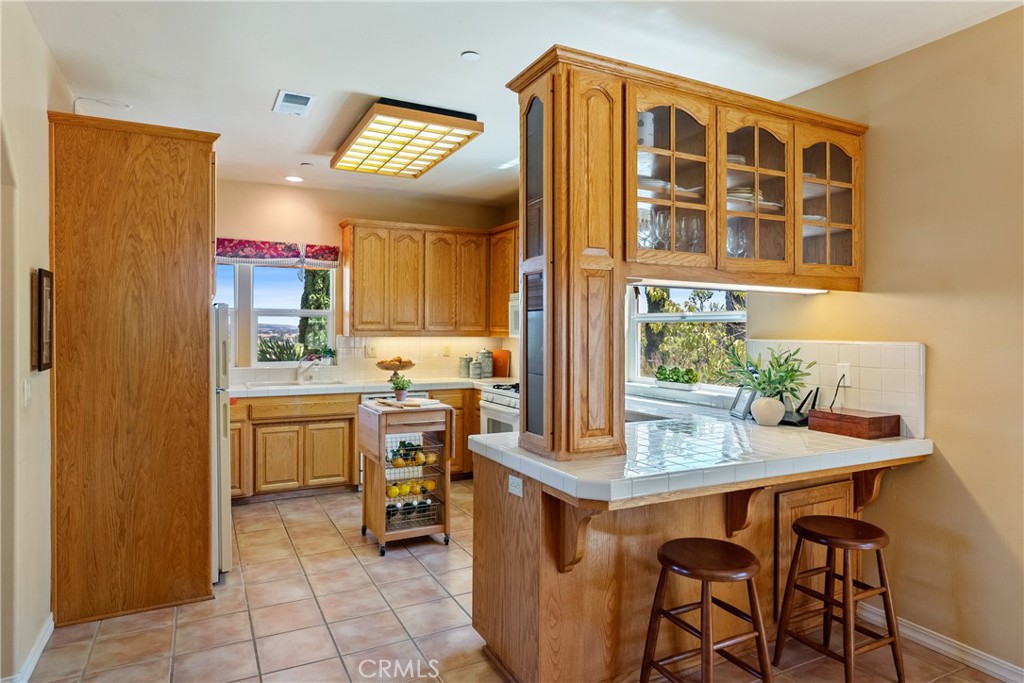 725 Spring Creek Way Templeton, CA 93465 - Photo 51 of 70 a dining room with a wooden table and chairs