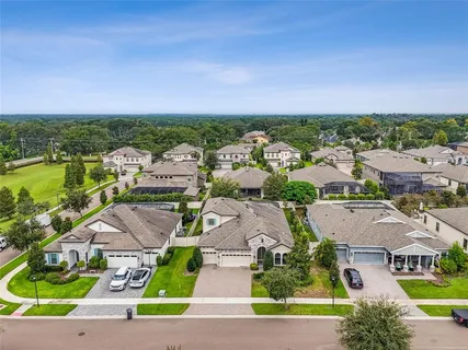 an aerial view of a houses with a garden