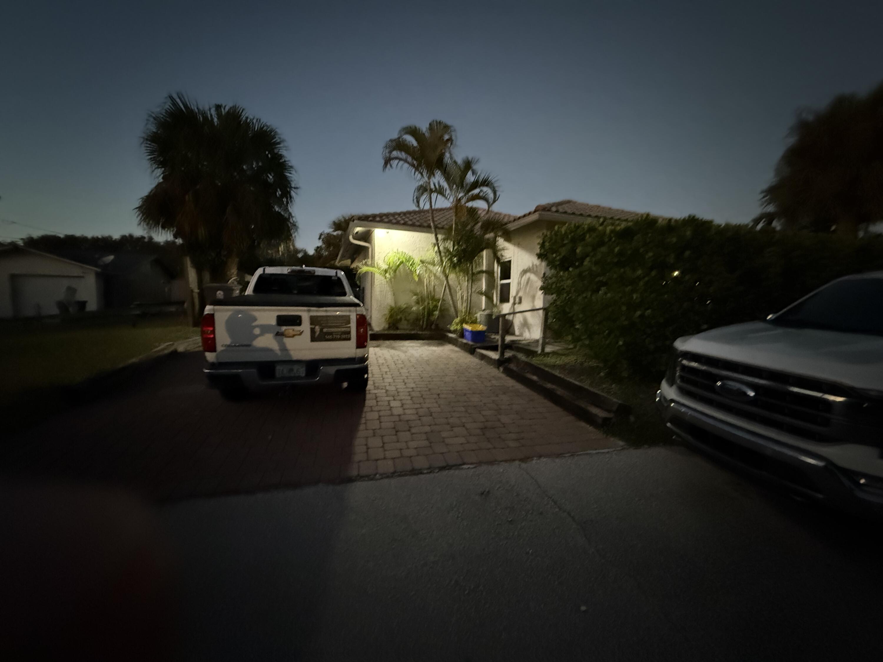 11865 Ellison Wilson Road, Unit A North Palm Beach, FL 33408 - Photo 11 of 12 a car parked on the side of the road