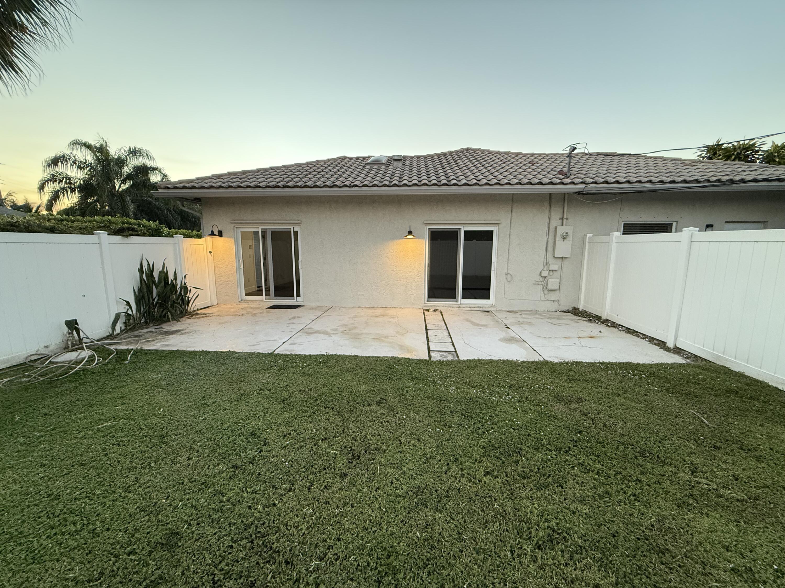 11865 Ellison Wilson Road, Unit A North Palm Beach, FL 33408 - Photo 9 of 12 a house view with a garden space