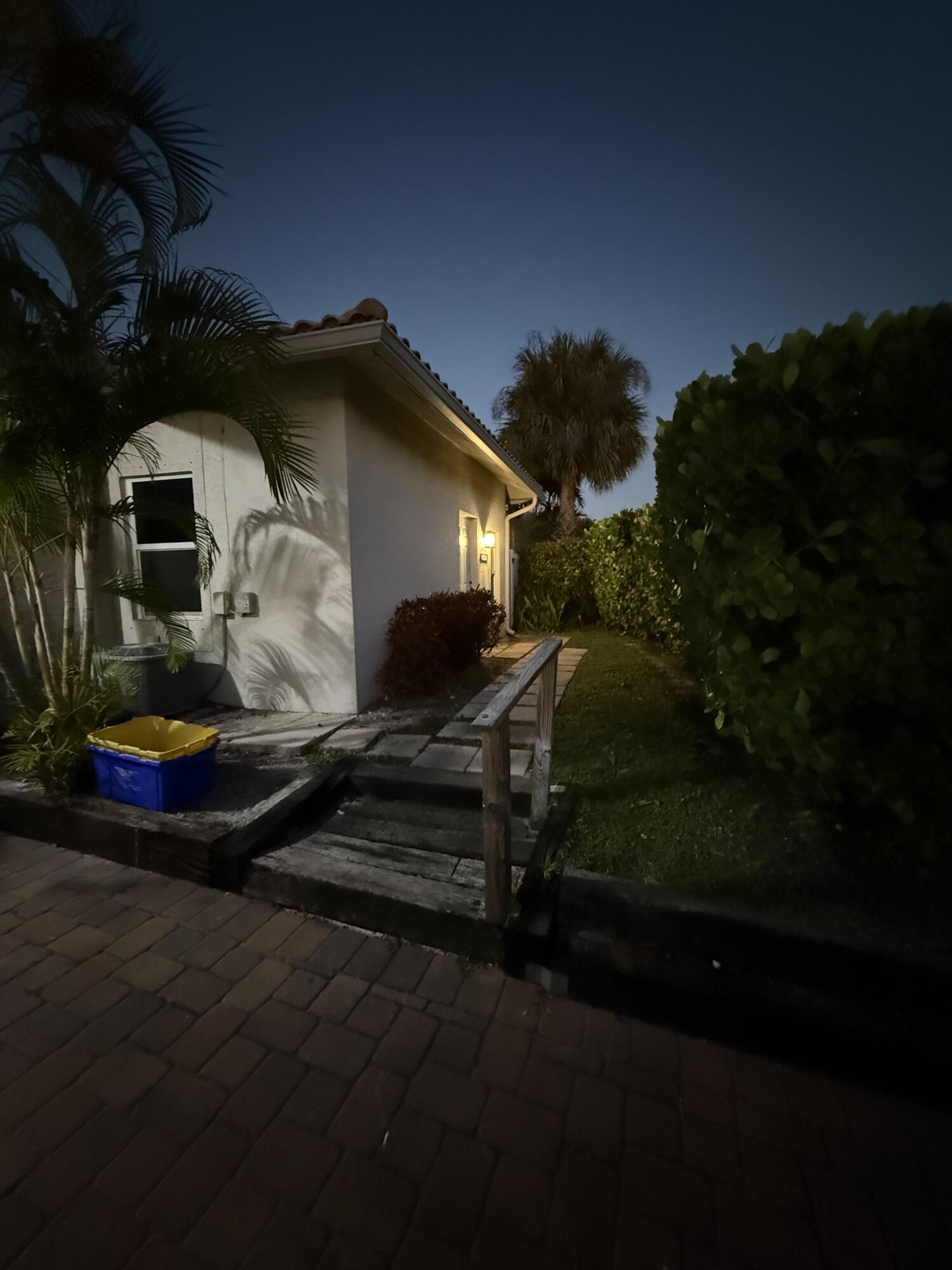 11865 Ellison Wilson Road, Unit A North Palm Beach, FL 33408 - Photo 10 of 12 a front view of a house with garden