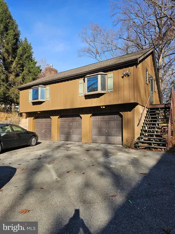 a front view of a house with parking space