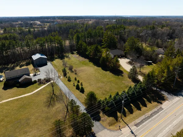 a view of a swimming pool with a yard