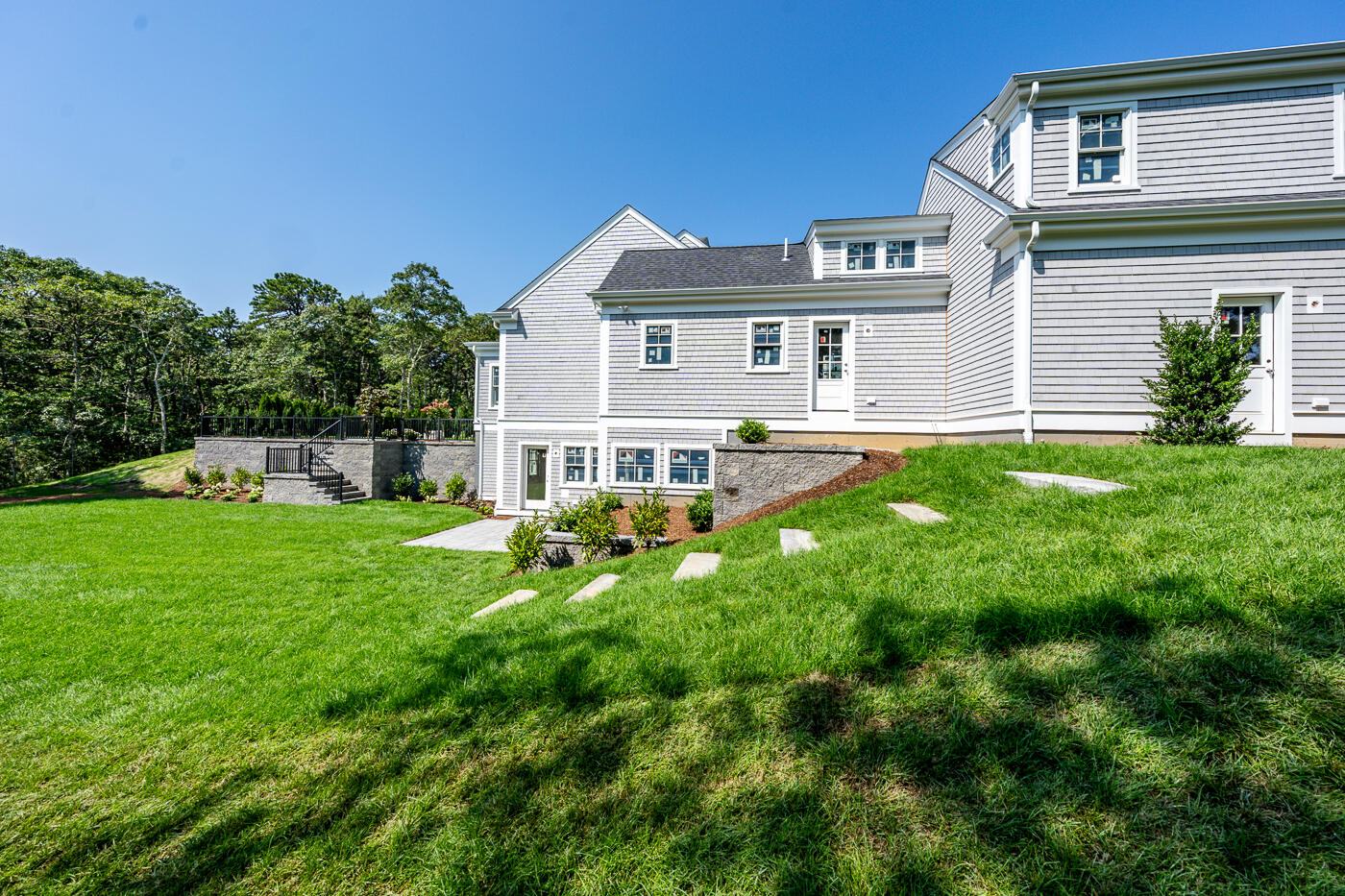8 Bascom Hollow Harwich, MA 02645 - Photo 8 of 13 a front view of a house with a yard and green space