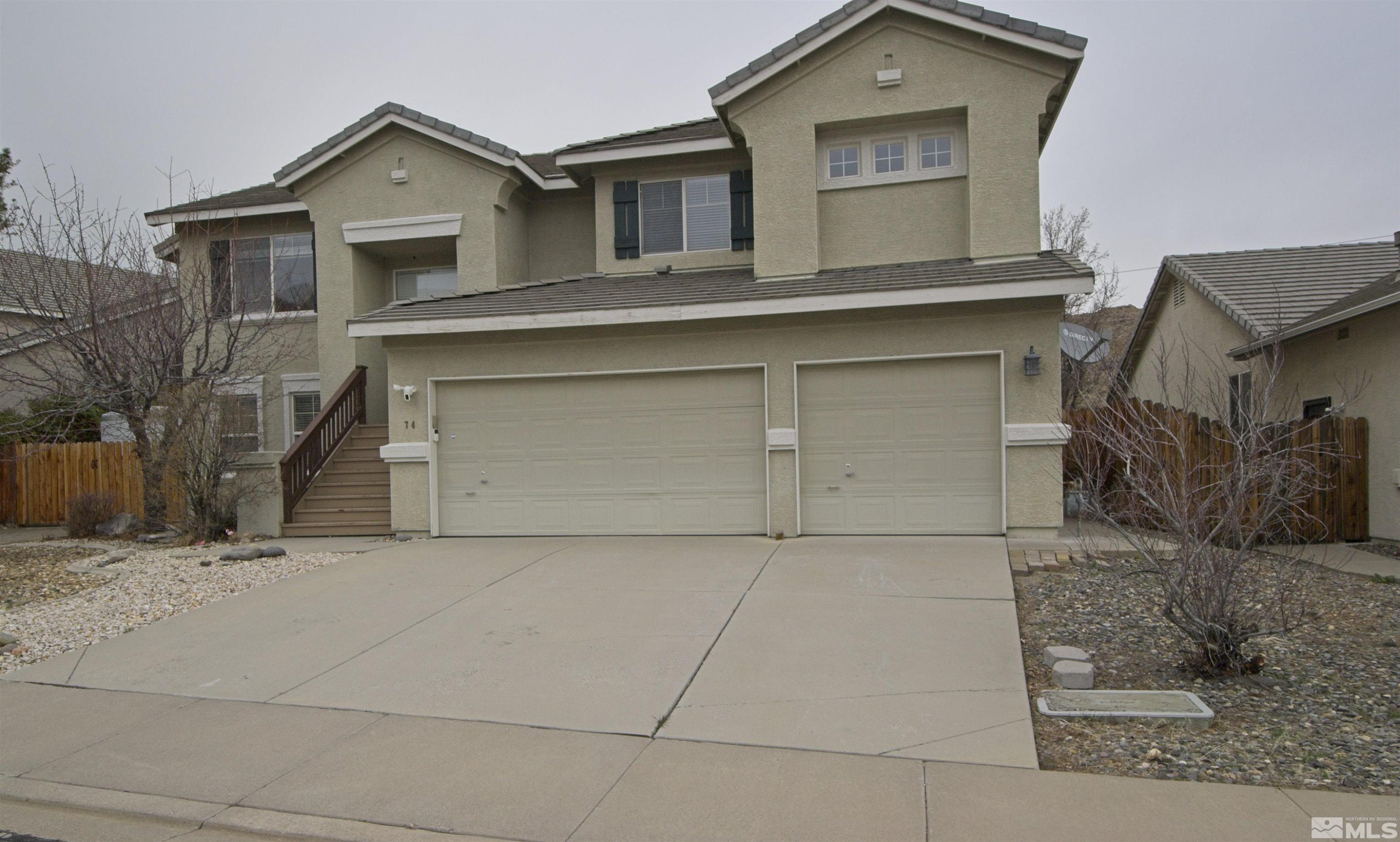 74 River Front Drive Reno, NV 89523 - Photo 1 of 28 a front view of a house with garage