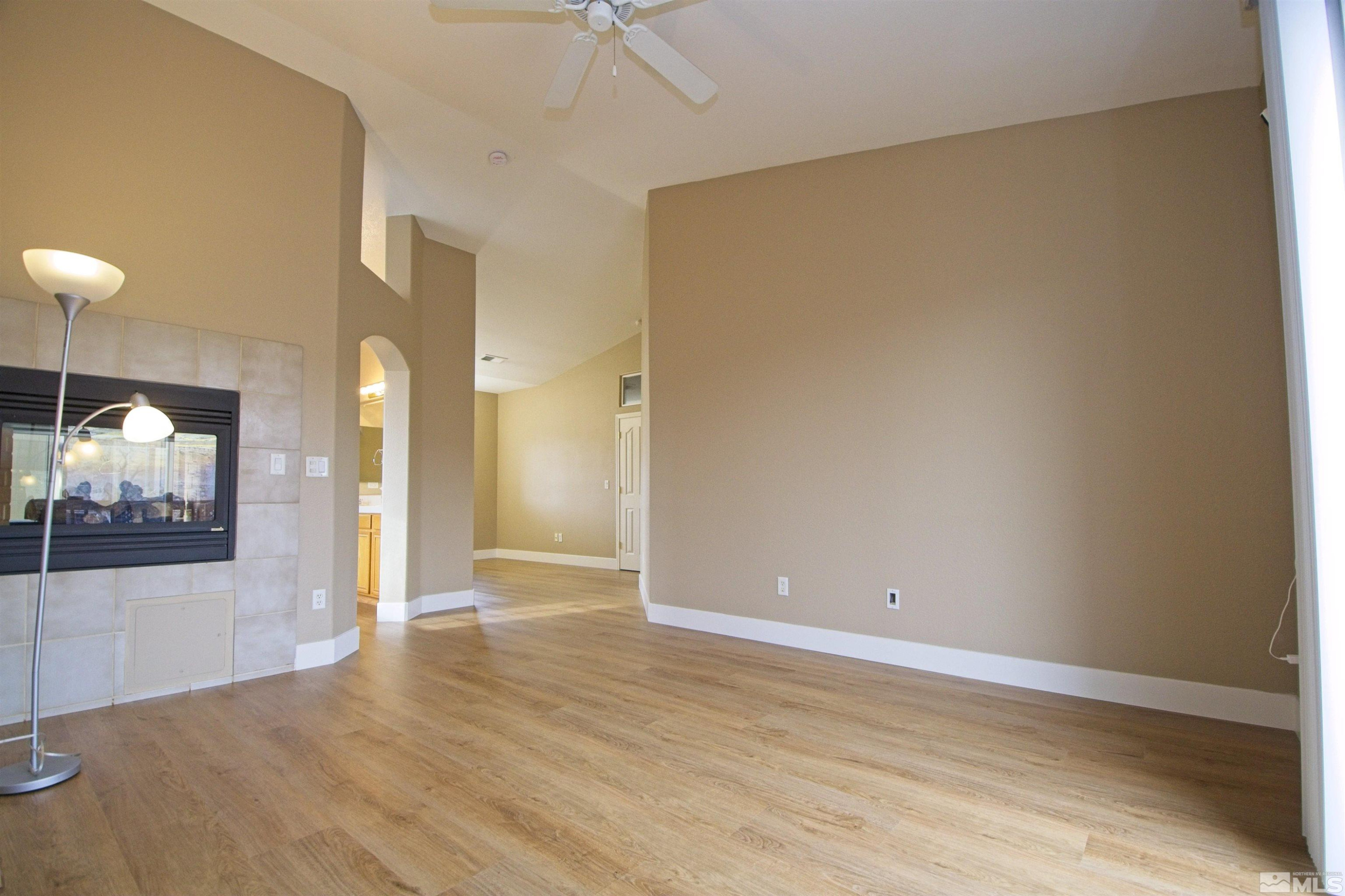 74 River Front Drive Reno, NV 89523 - Photo 11 of 28 a view of a hallway with wooden floor