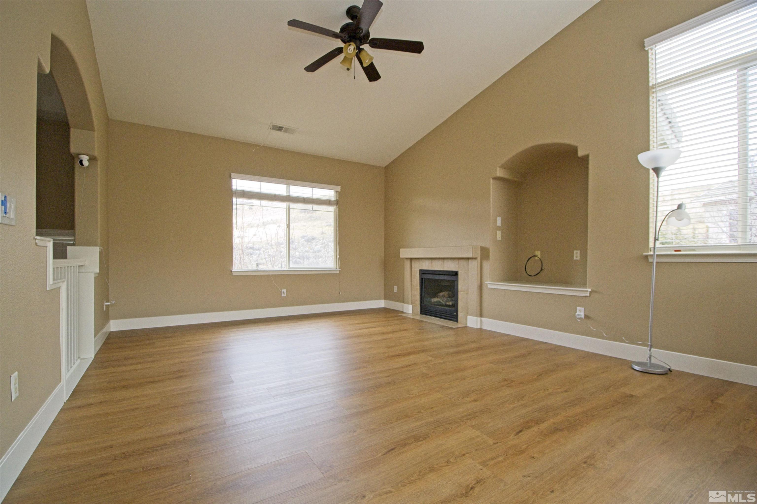 74 River Front Drive Reno, NV 89523 - Photo 3 of 28 a view of an empty room with a window and fireplace