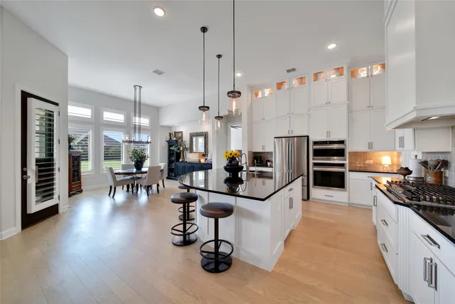 a kitchen with granite countertop a stove and a sink