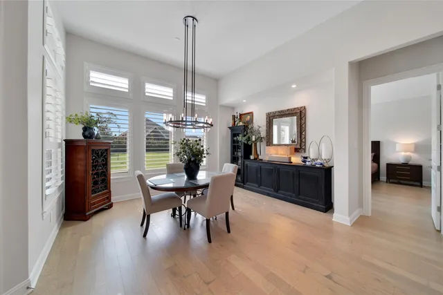 a spacious bedroom with a bed window and a couch