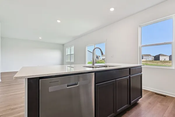 a kitchen with a sink and cabinets