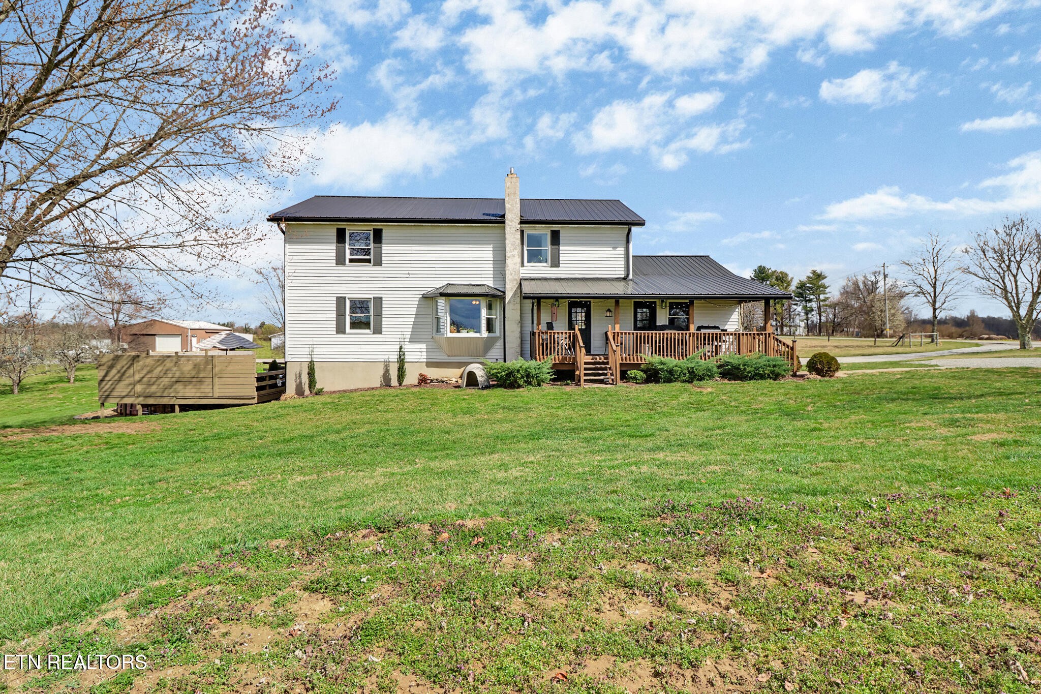 7616 Plateau Road Crossville, TN 38571 - Photo 1 of 60 a front view of house with yard and green space