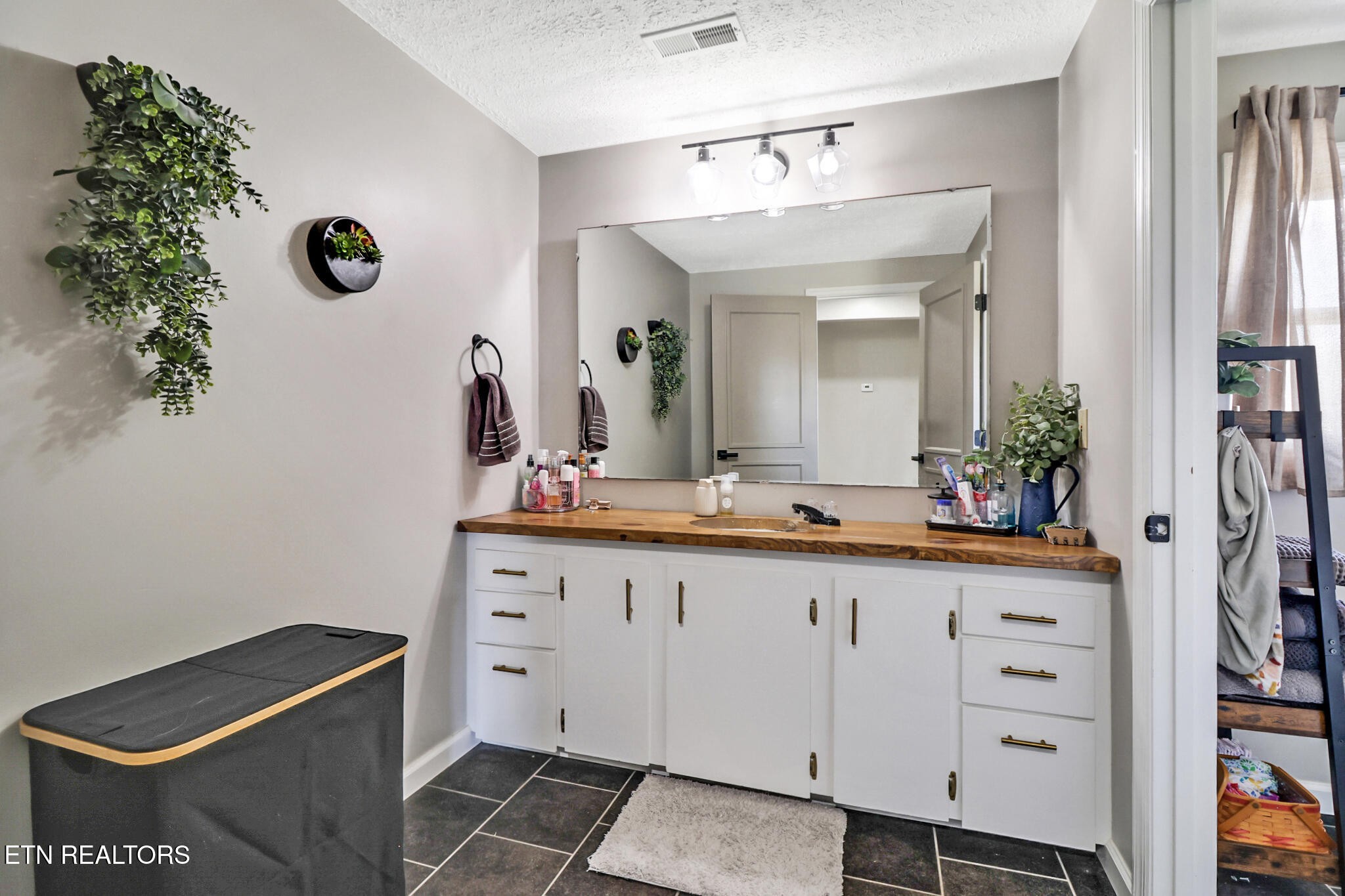 7616 Plateau Road Crossville, TN 38571 - Photo 24 of 60 a bathroom with a sink and a mirror