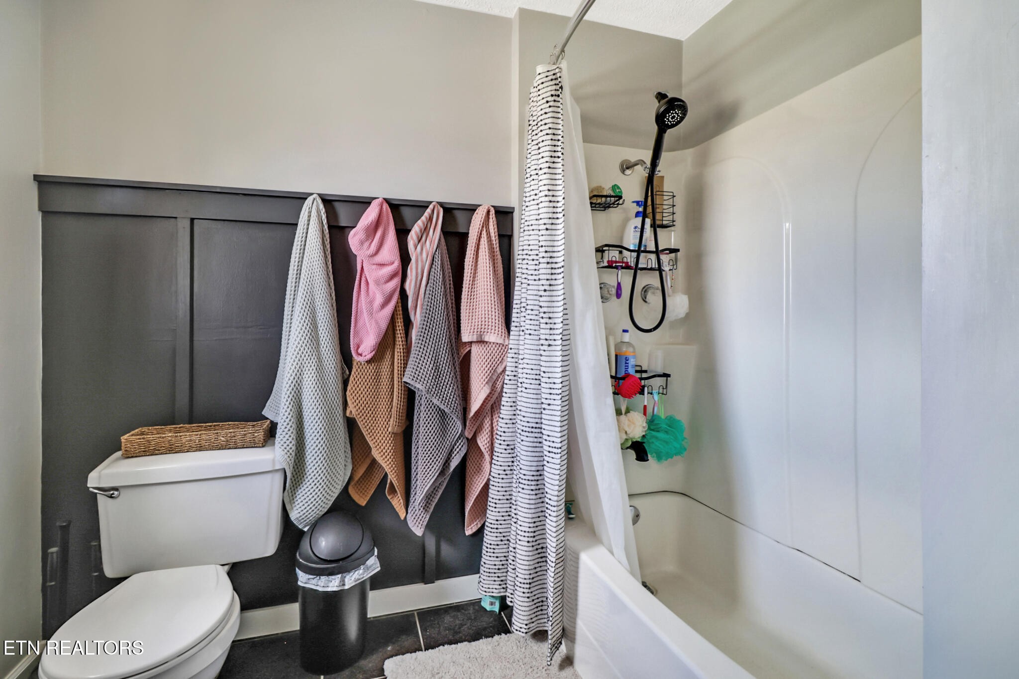 7616 Plateau Road Crossville, TN 38571 - Photo 25 of 60 a bathroom with a toilet and a shower curtain
