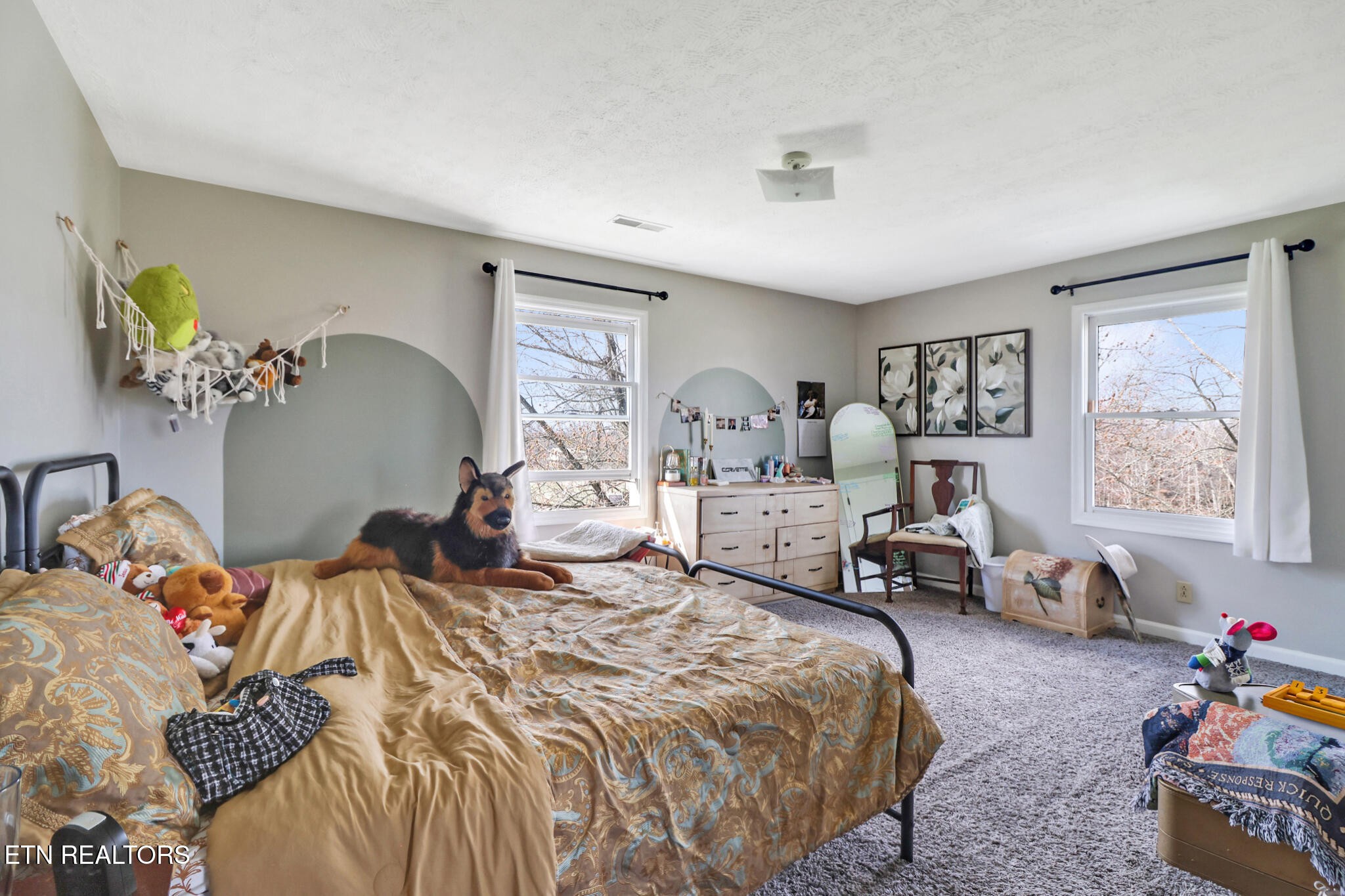 7616 Plateau Road Crossville, TN 38571 - Photo 26 of 60 a bedroom with a bed and wooden floor