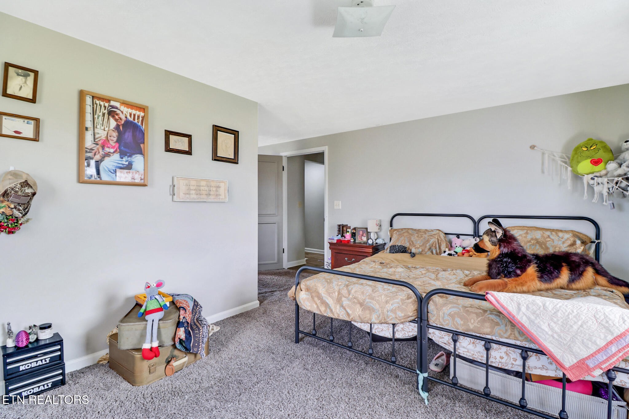 7616 Plateau Road Crossville, TN 38571 - Photo 27 of 60 a bedroom with a bed and a couch