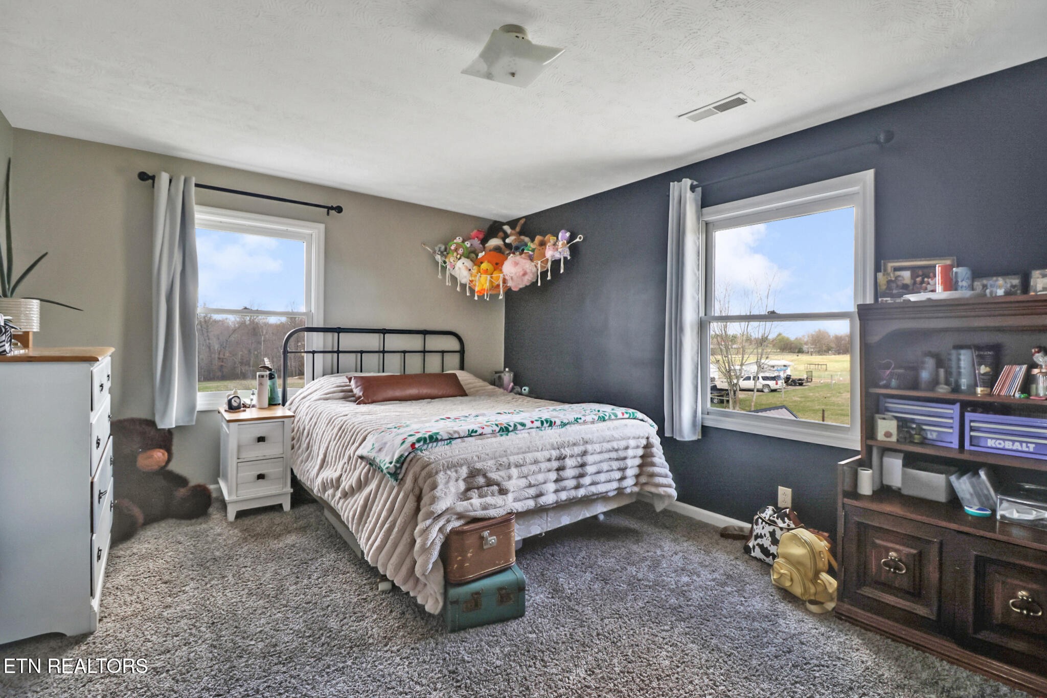 7616 Plateau Road Crossville, TN 38571 - Photo 28 of 60 a bedroom with a bed and a window