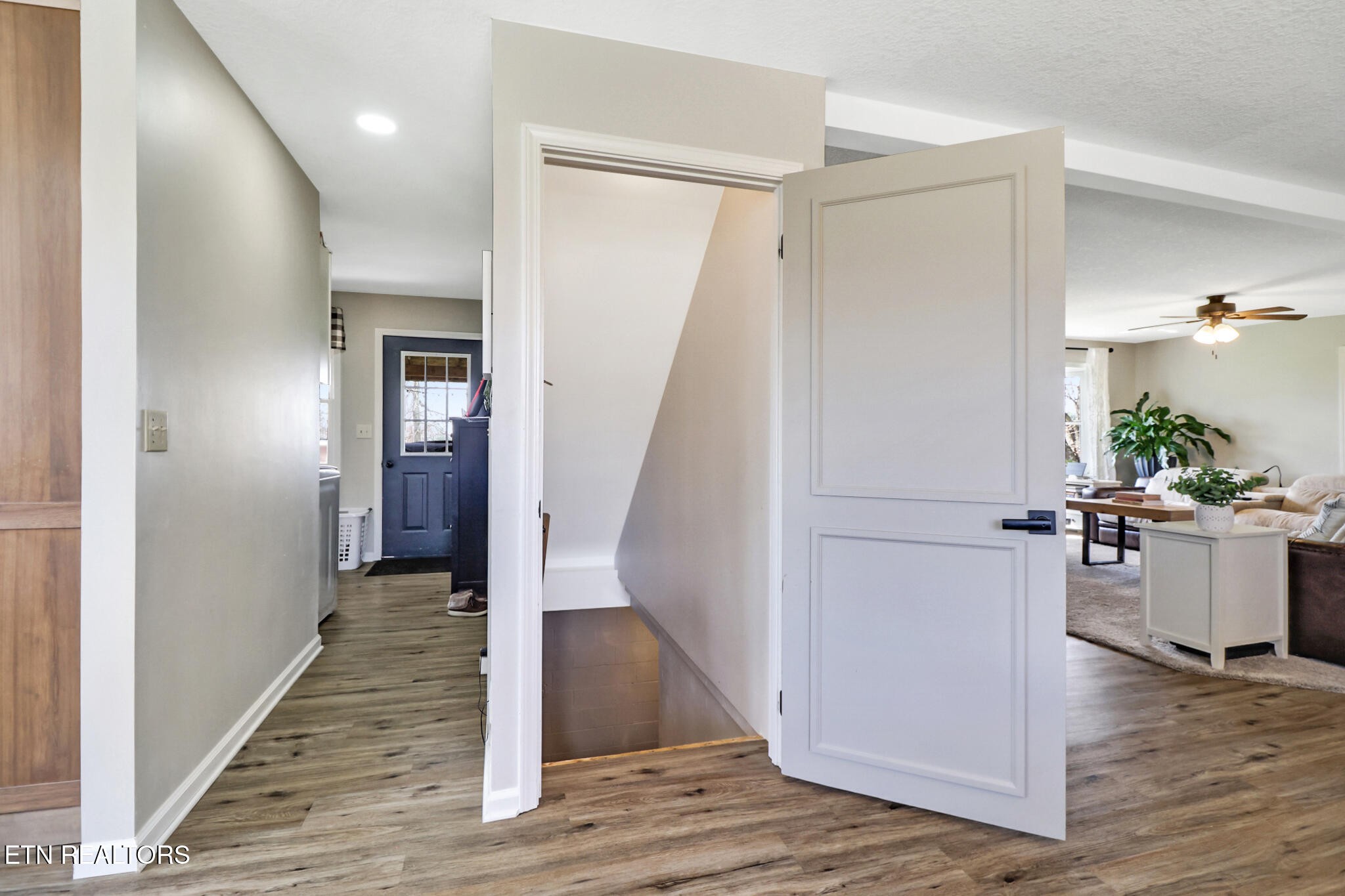 7616 Plateau Road Crossville, TN 38571 - Photo 30 of 60 a view of a hallway with wooden floor and staircase