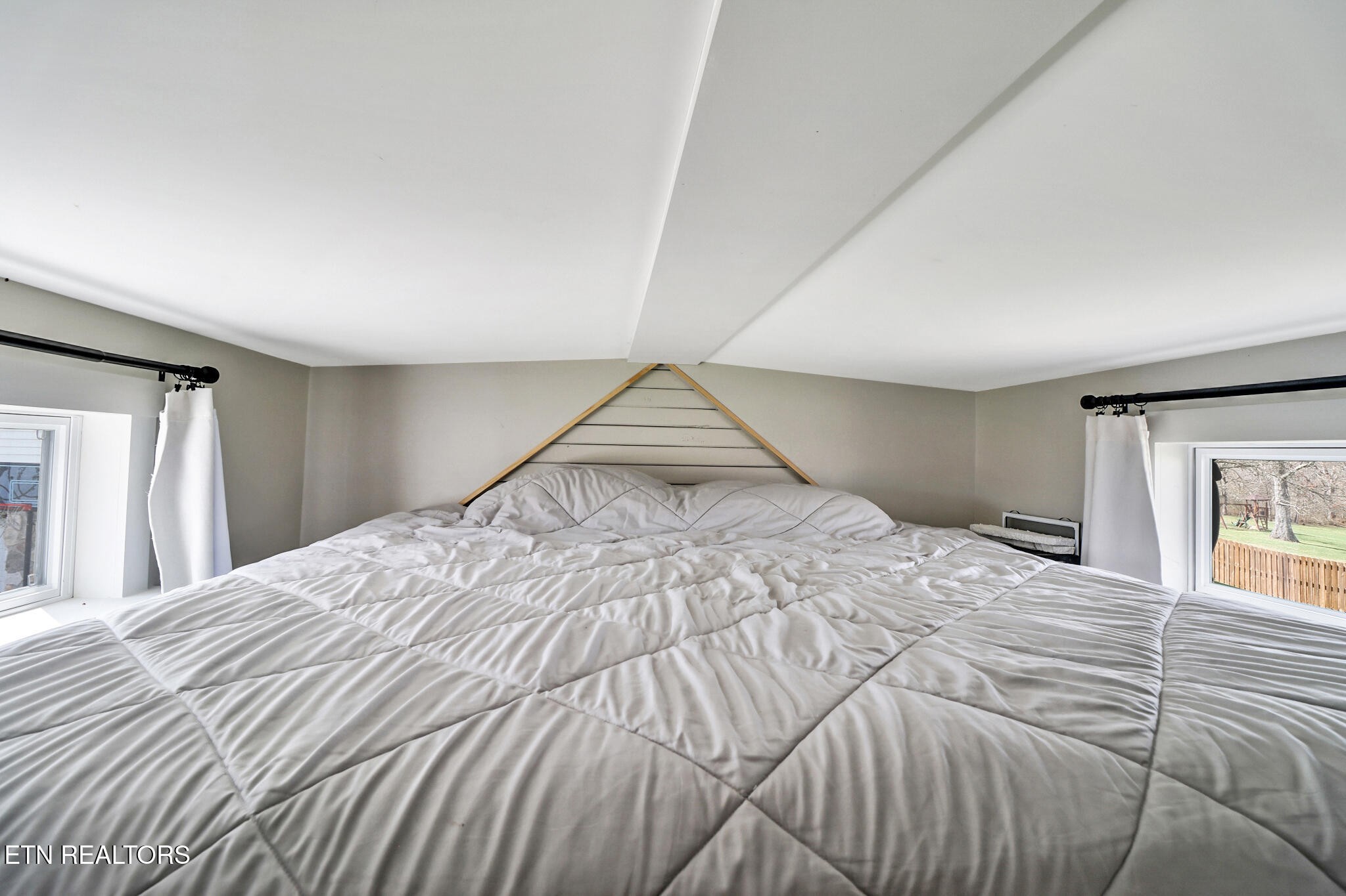 7616 Plateau Road Crossville, TN 38571 - Photo 47 of 60 a bedroom with a bed and a window