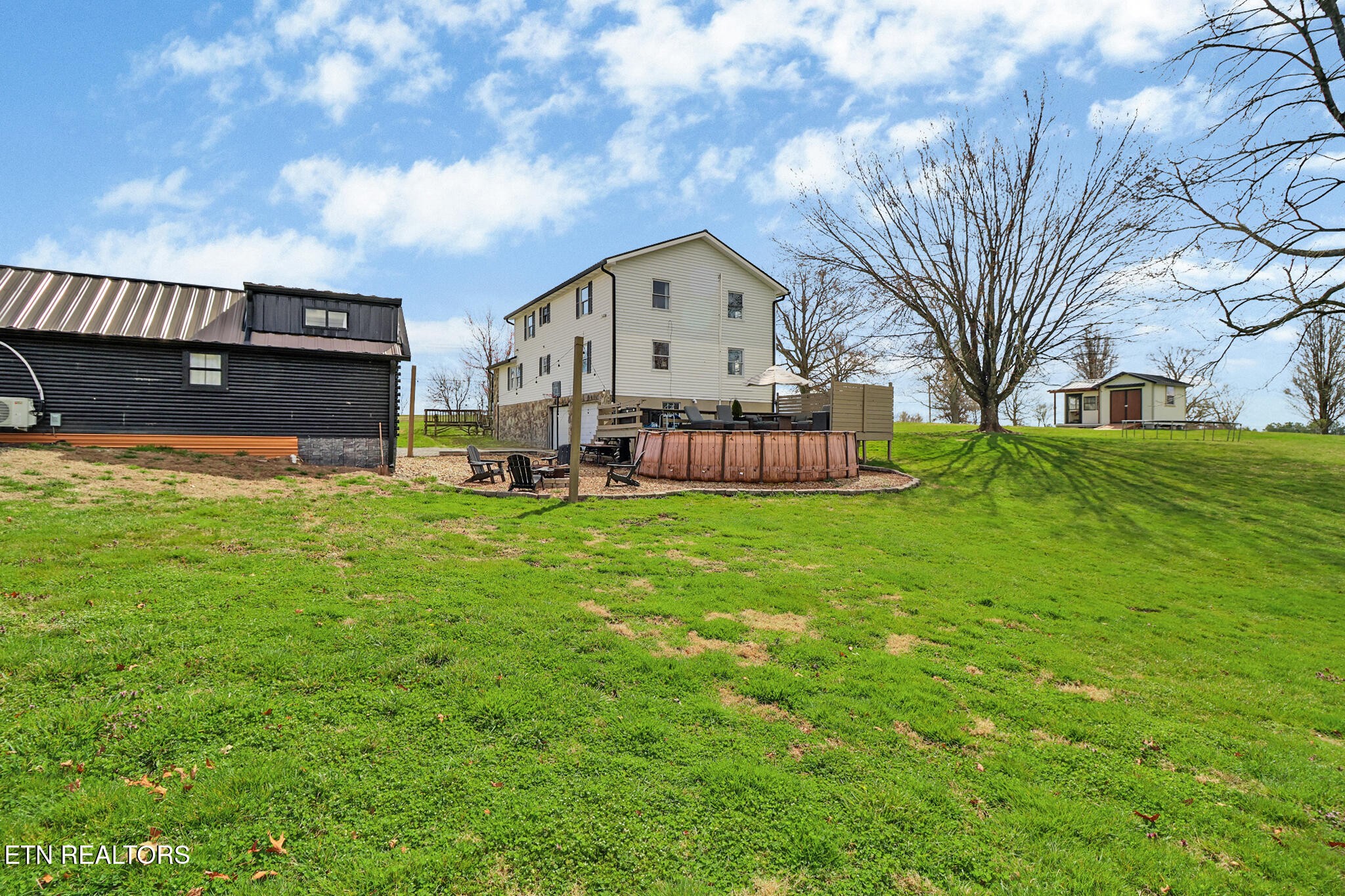 7616 Plateau Road Crossville, TN 38571 - Photo 54 of 60 a large house with a big yard and large trees