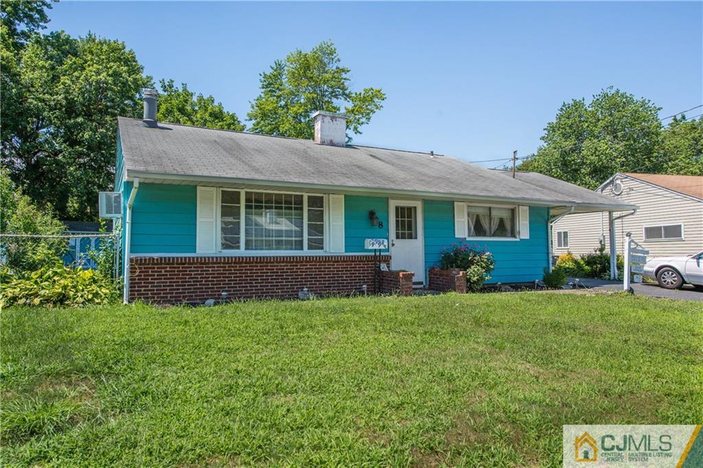 8 Baxter Road Edison, NJ 08817 - Photo 2 of 18 a view of a house with a yard and potted plants