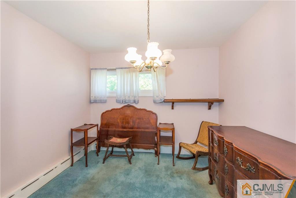 8 Baxter Road Edison, NJ 08817 - Photo 14 of 18 a dining room with furniture and window