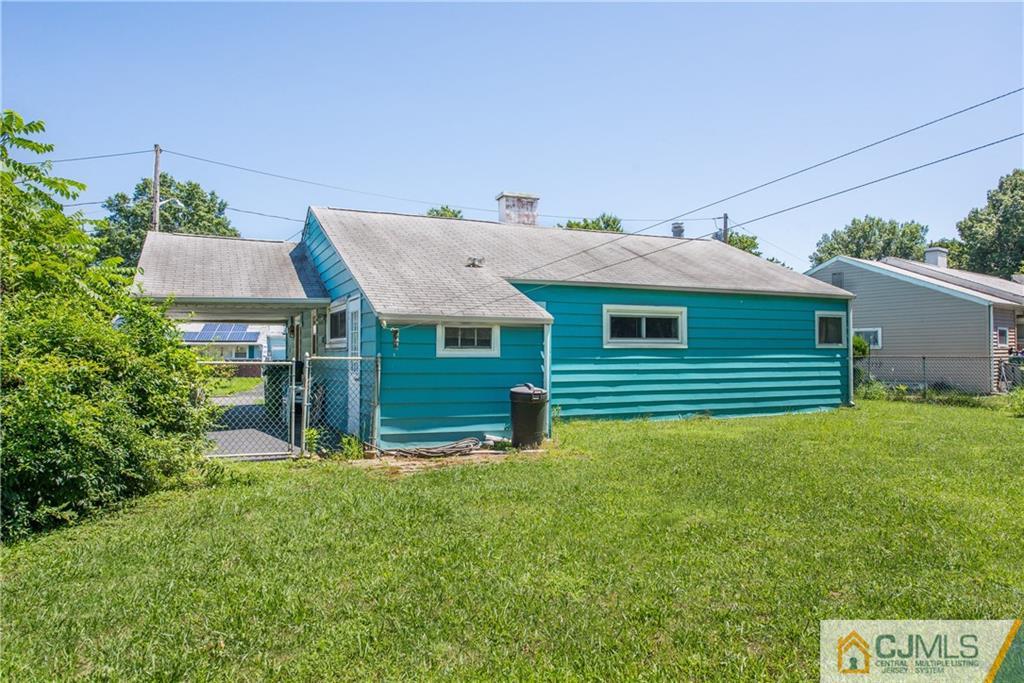 8 Baxter Road Edison, NJ 08817 - Photo 17 of 18 a front view of a house with a yard