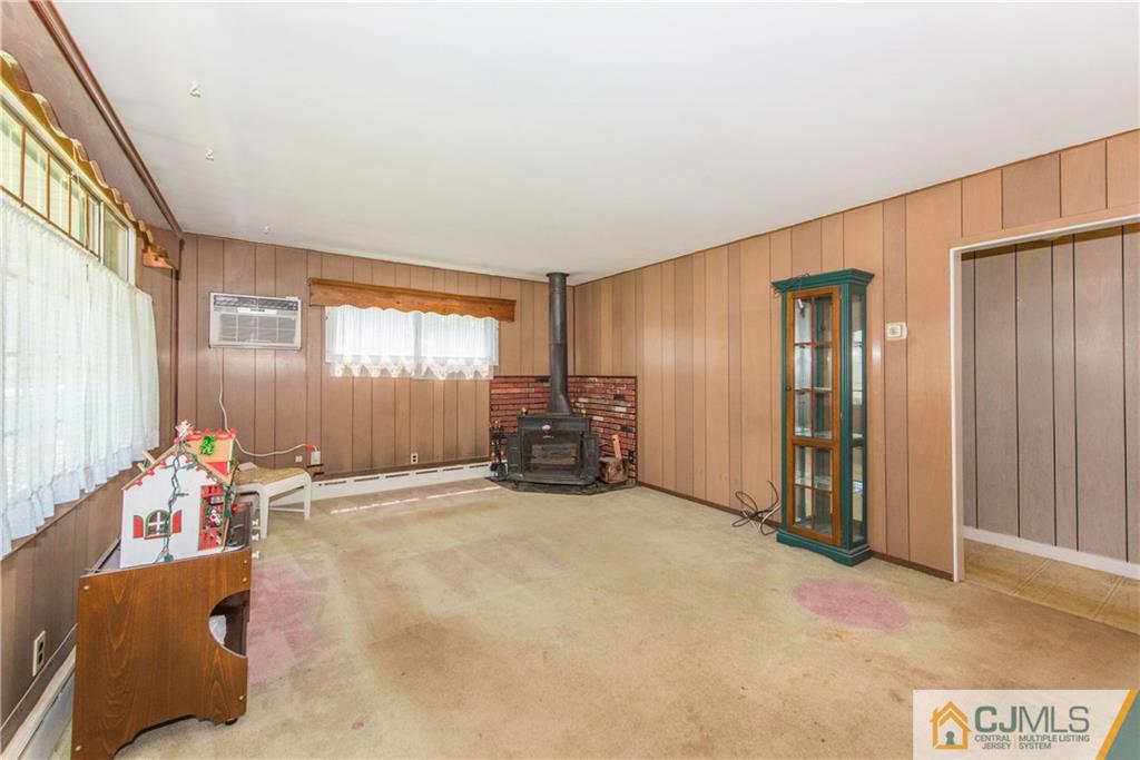 8 Baxter Road Edison, NJ 08817 - Photo 3 of 18 a view of a livingroom with furniture and windows