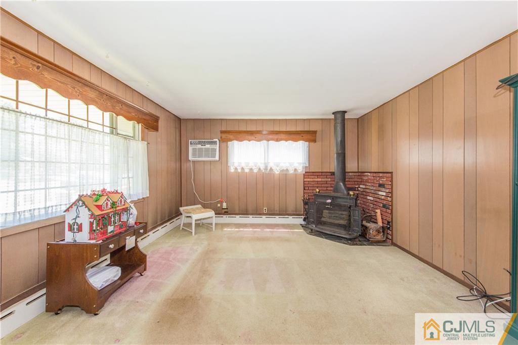 8 Baxter Road Edison, NJ 08817 - Photo 4 of 18 a bedroom with furniture and a large window