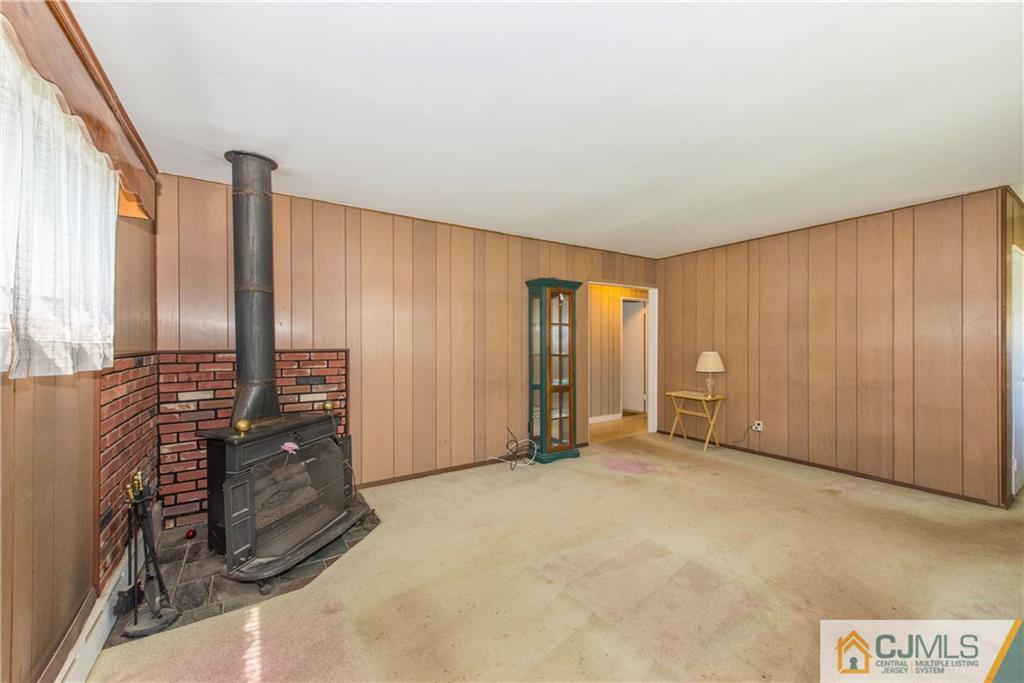8 Baxter Road Edison, NJ 08817 - Photo 5 of 18 a view of an empty room with windows