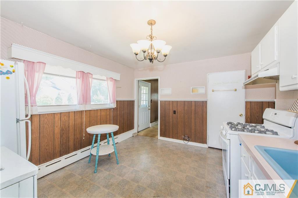 8 Baxter Road Edison, NJ 08817 - Photo 8 of 18 a very nice looking room with a chandelier