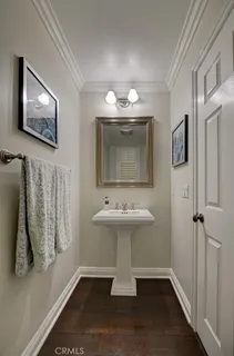 a bathroom with a sink a mirror and a toilet