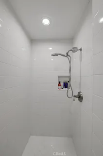 a view of a porch with furniture and garden