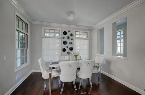 a view of a dining room with furniture and window
