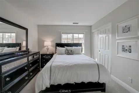 a bathroom with a double vanity sink toilet and shower