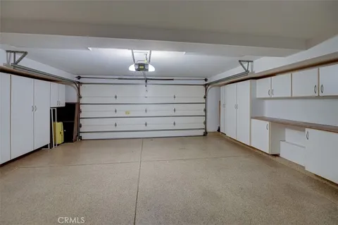 a view of a patio with table and chairs and potted plants