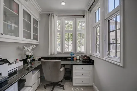 a kitchen with a stove a sink and a cabinets