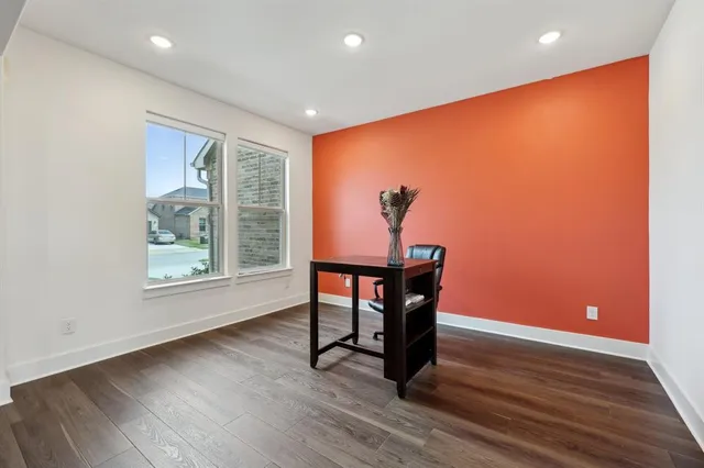 a view of room with furniture and wooden floor