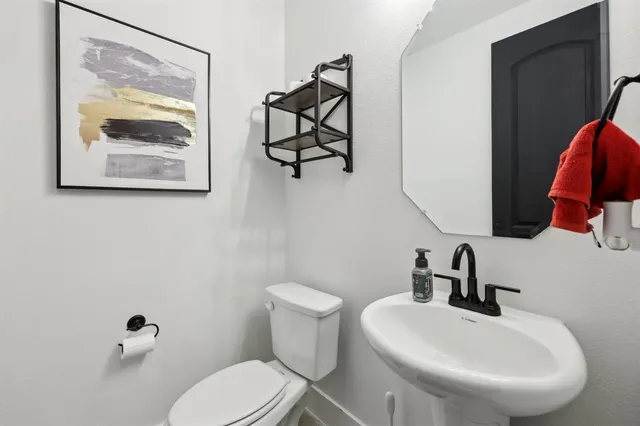 a bathroom with a toilet and a sink