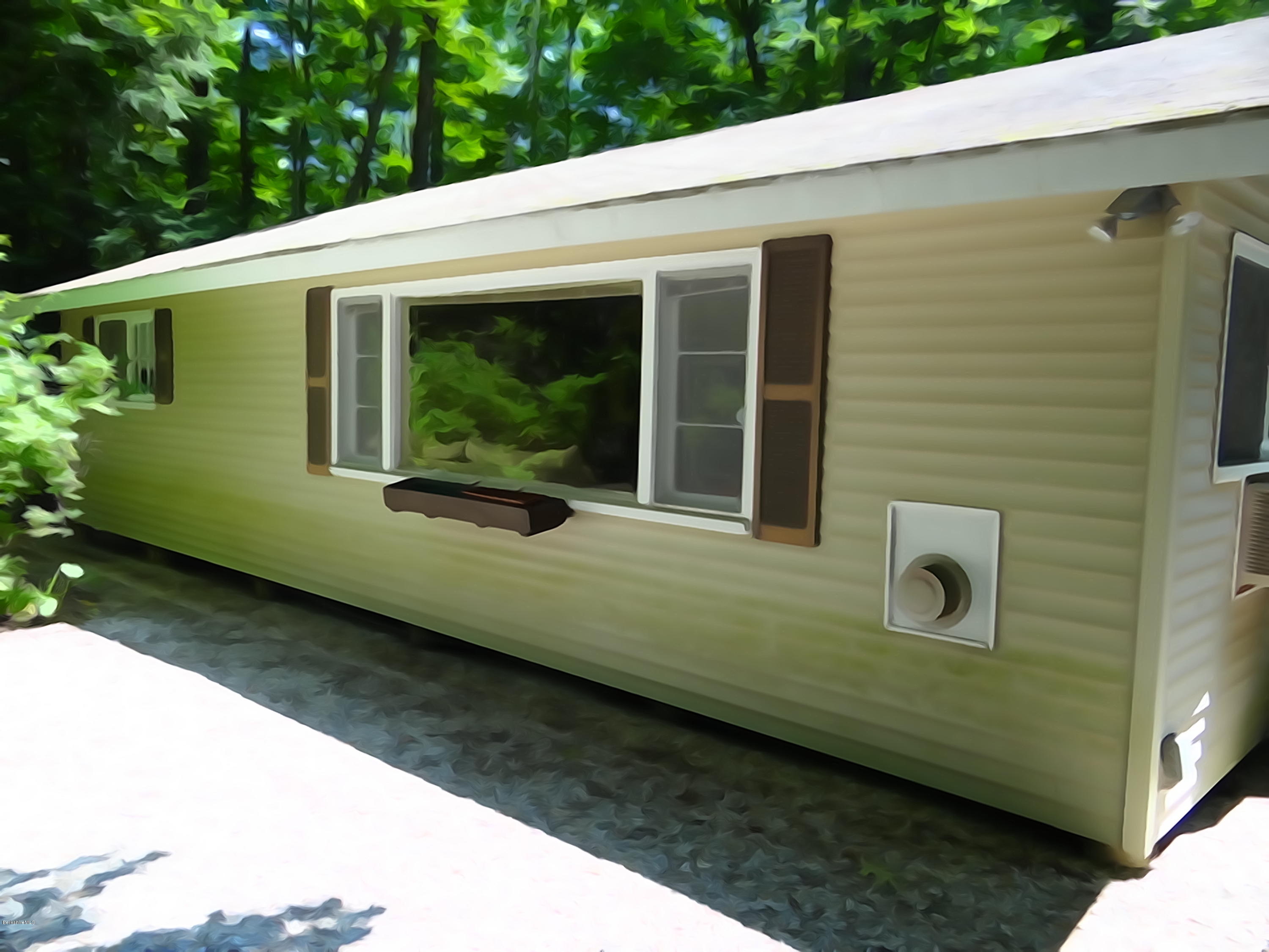 2 Woods Road Stockbridge, MA 01262 - Photo 1 of 10 a front view of a house with garden