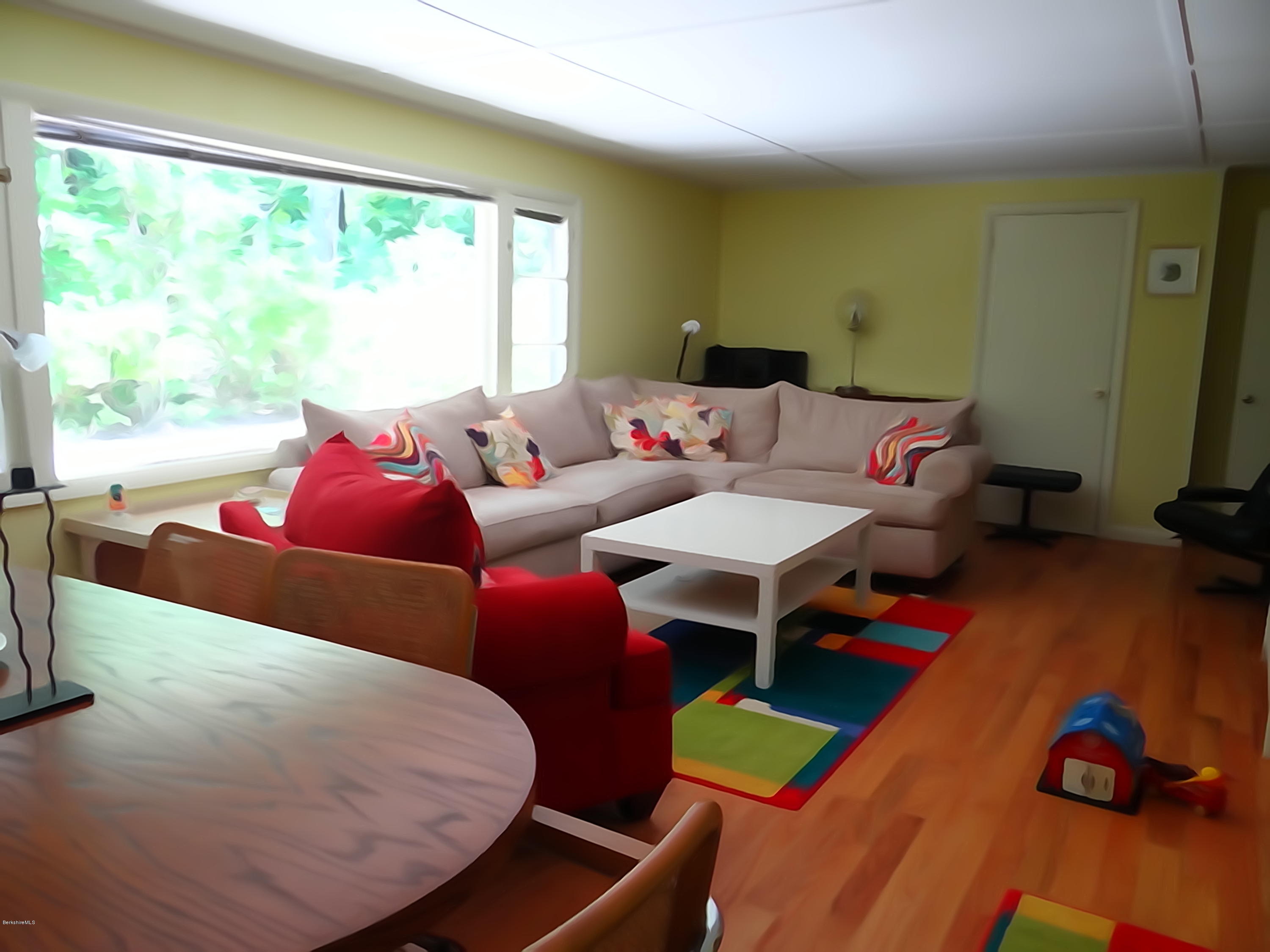 2 Woods Road Stockbridge, MA 01262 - Photo 4 of 10 a living room with furniture and a large window
