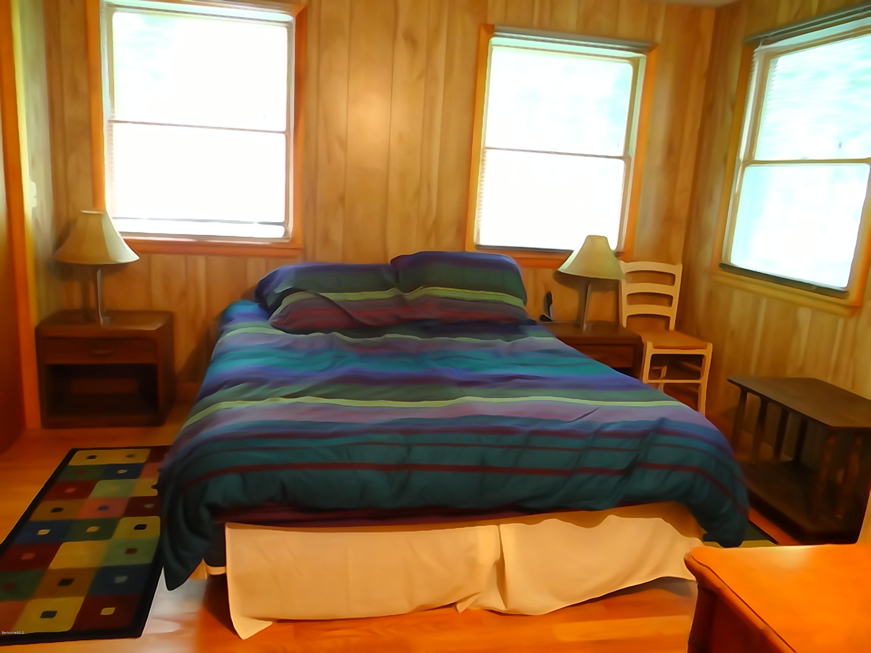 2 Woods Road Stockbridge, MA 01262 - Photo 7 of 10 a bedroom with a bed and a window