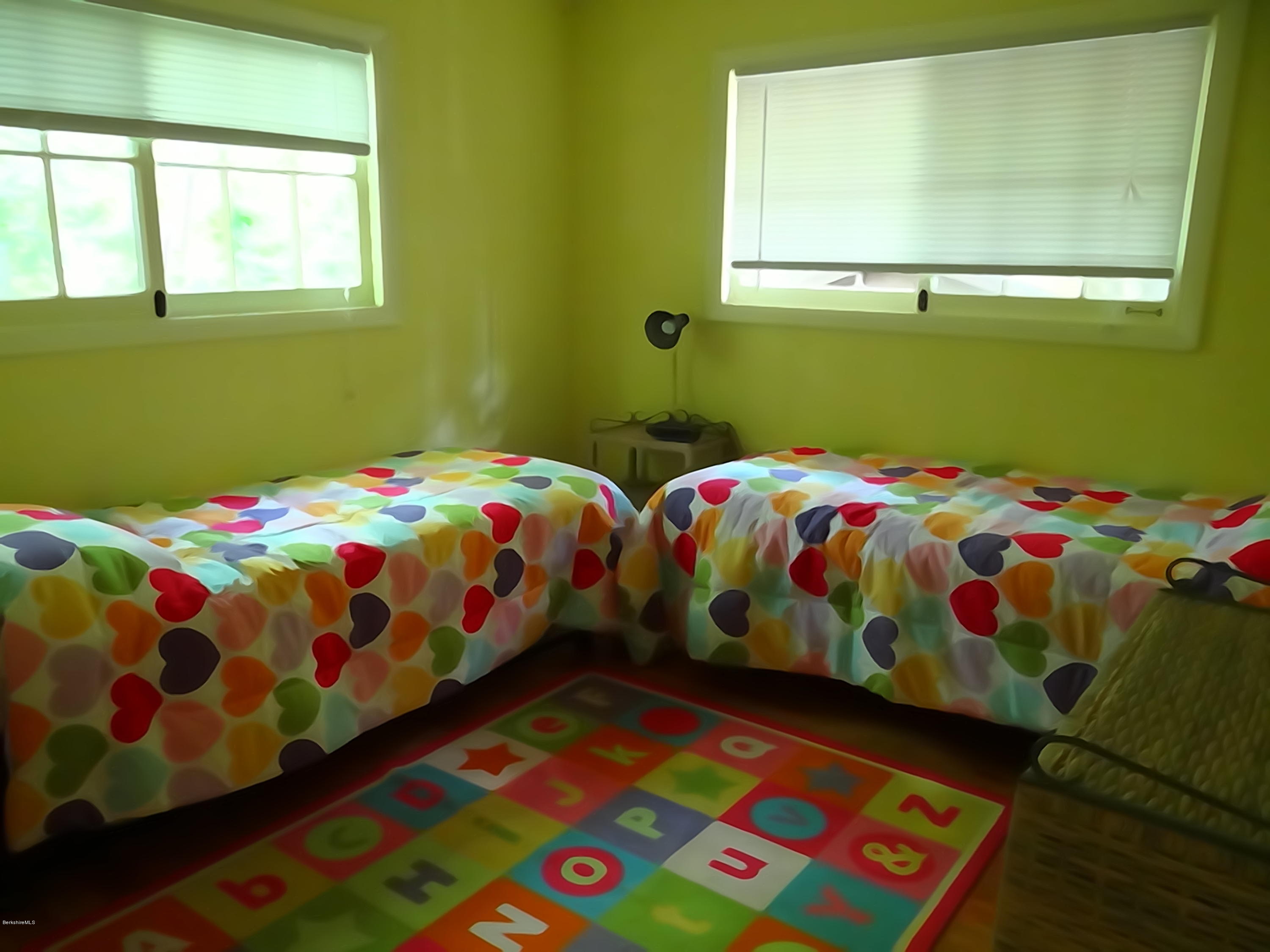 2 Woods Road Stockbridge, MA 01262 - Photo 10 of 10 a bedroom with two beds next to a window