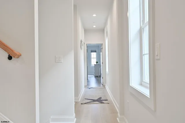 a room with a window and flowerpot