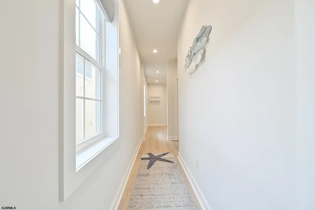 a bathroom with a granite countertop sink mirror and double