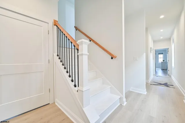 a kitchen with stainless steel appliances white cabinets and a sink