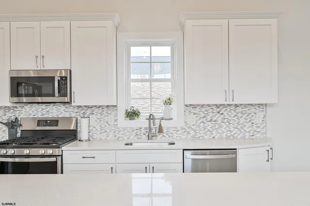 a living room with furniture and windows