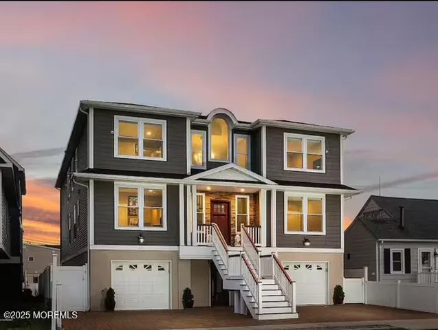 a front view of a residential apartment building with a yard