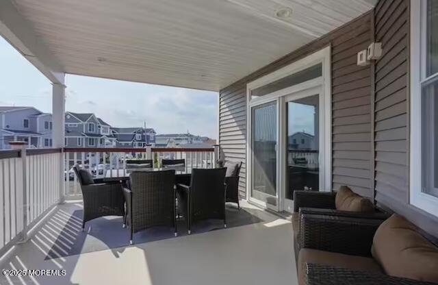 431 Hiering Avenue Seaside Heights, NJ 08751 - Photo 12 of 32 a balcony with furniture and a potted plant