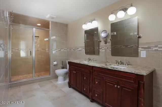 a bathroom with a granite countertop sink mirror and double